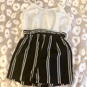 $11 Black and white women’s medium romper